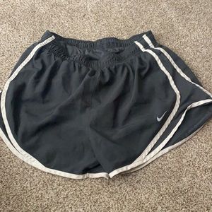 grey and white Nike shorts